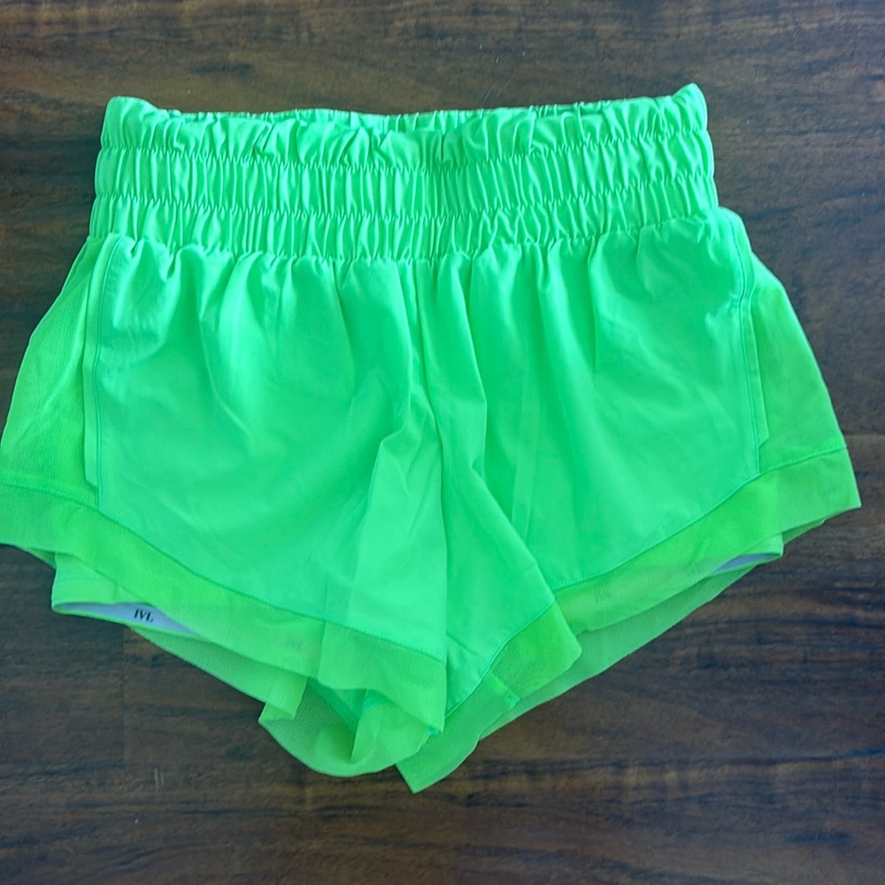 IVL Collective neon yellow shorts.